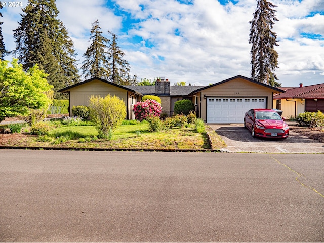 ranch-style home featuring a garage