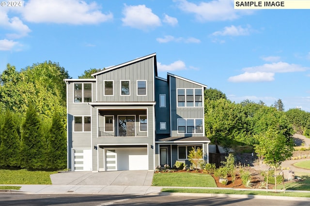 modern home with a balcony and a garage