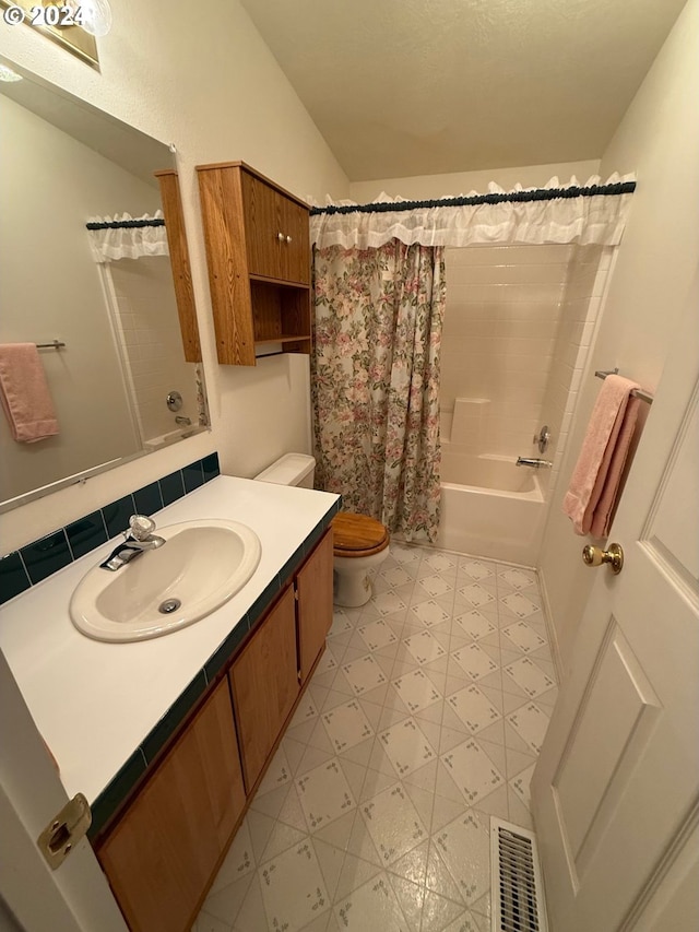 full bathroom featuring toilet, vanity, and shower / bath combo