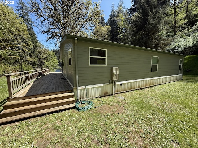 2647 S Tenmile, Lakeside, OR 97449 - view of side of home featuring a wooden deck and a yard