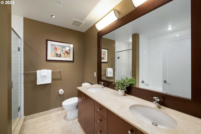 bathroom with vanity, toilet, an enclosed shower, and tile patterned floors