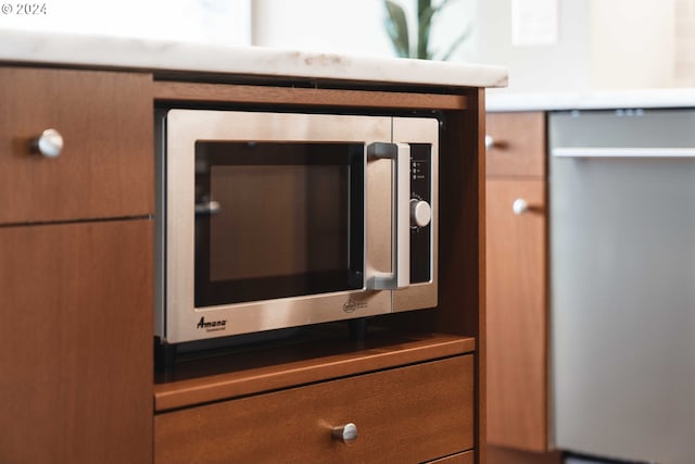 interior details featuring appliances with stainless steel finishes