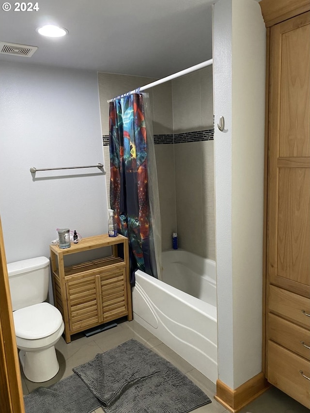 bathroom with toilet, shower / bathtub combination with curtain, and tile patterned floors