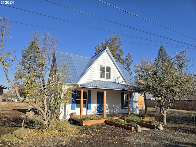 705 Couch Ave, Wallowa, OR 97885 - view of front of property with covered porch and metal roof