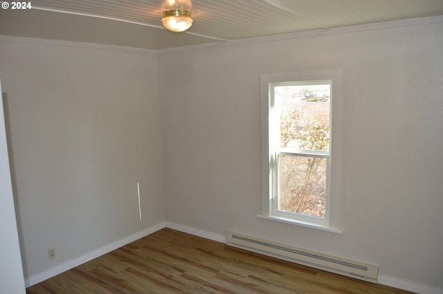 705 Couch Ave, Wallowa, OR 97885 - unfurnished room featuring baseboard heating, wood finished floors, and baseboards