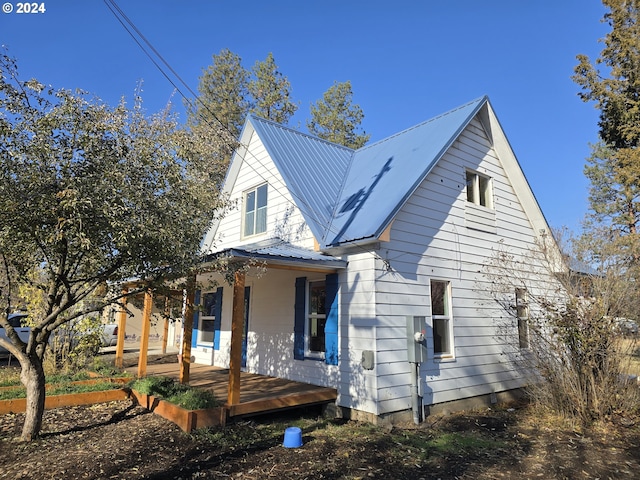 view of property exterior with covered porch