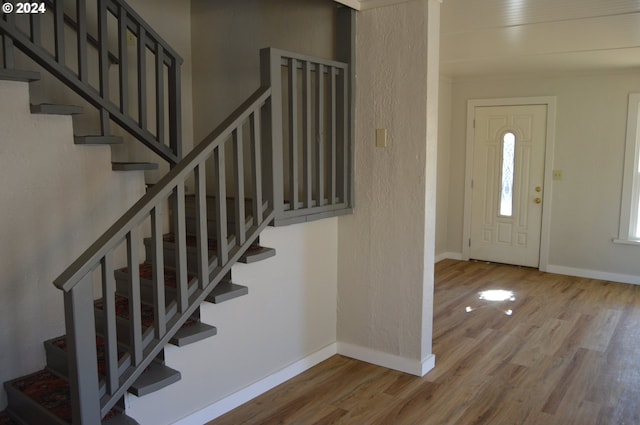 705 Couch Ave, Wallowa, OR 97885 - entrance foyer featuring wood finished floors, stairs, and baseboards