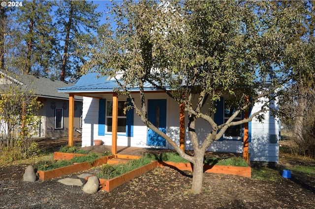 705 Couch Ave, Wallowa, OR 97885 - view of front of home with a porch and metal roof