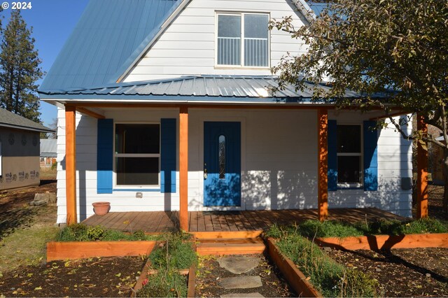 705 Couch Ave, Wallowa, OR 97885 - view of front of home with a porch and metal roof