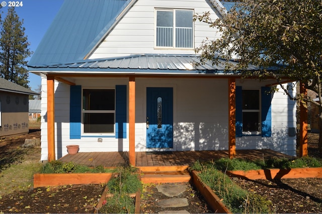 705 Couch Ave, Wallowa, OR 97885 - view of front of home featuring covered porch and metal roof