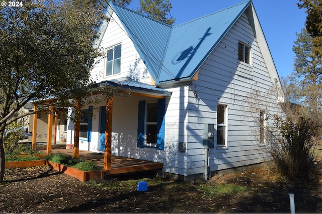 705 Couch Ave, Wallowa, OR 97885 - view of home's exterior featuring a porch and metal roof
