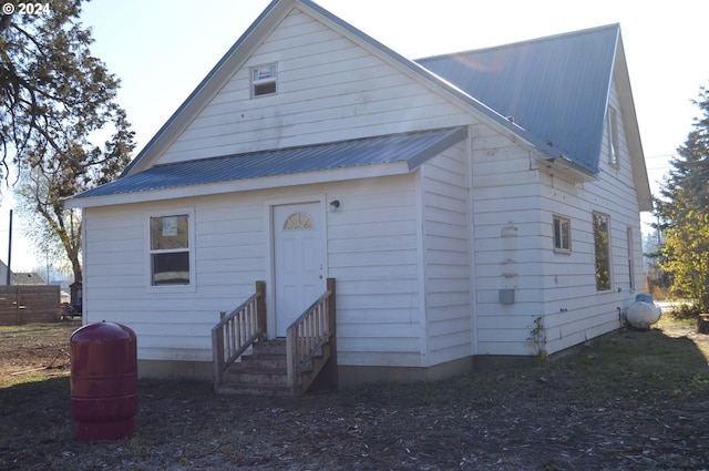 705 Couch Ave, Wallowa, OR 97885 - rear view of property featuring entry steps and metal roof