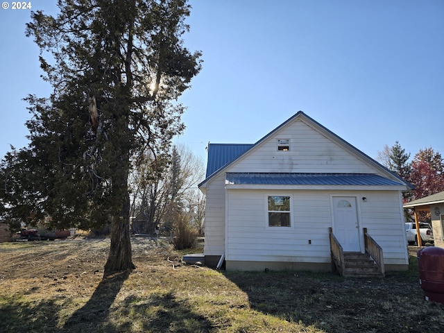 705 Couch Ave, Wallowa, OR 97885 - back of property featuring entry steps and metal roof