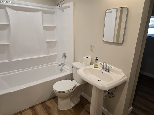 705 Couch Ave, Wallowa, OR 97885 - full bath featuring wood finished floors, toilet, tub / shower combination, baseboards, and a sink