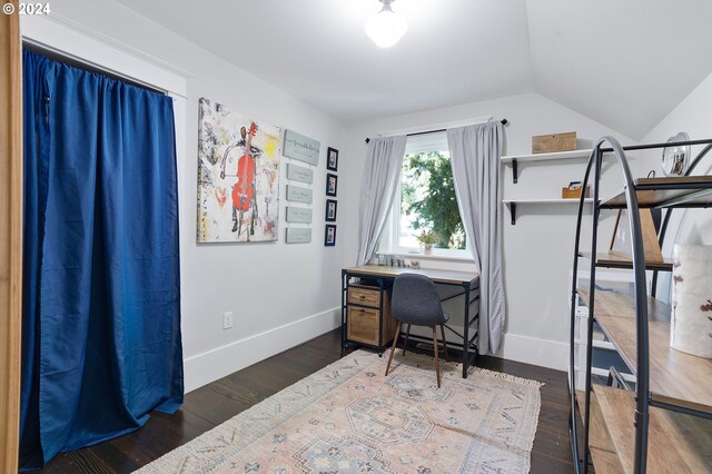 office space featuring dark wood-style floors, lofted ceiling, and baseboards