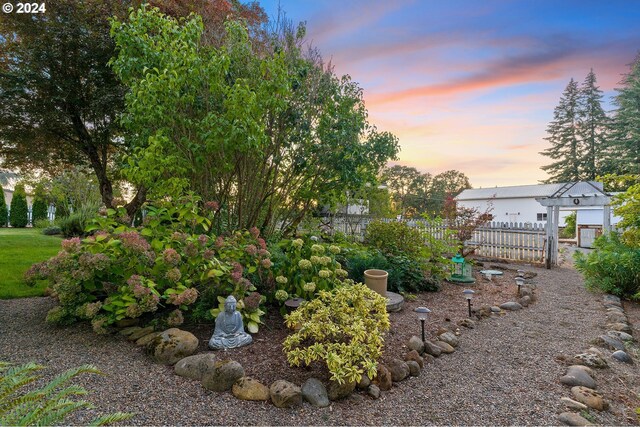 yard at dusk with fence