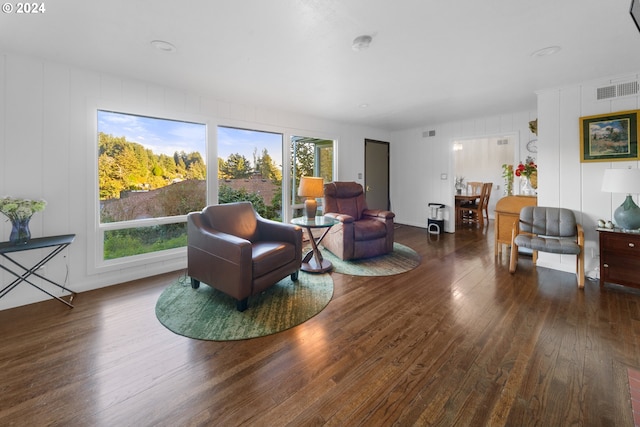 living room with dark hardwood / wood-style floors