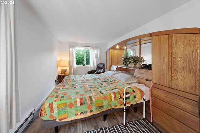 bedroom featuring hardwood / wood-style flooring and baseboard heating