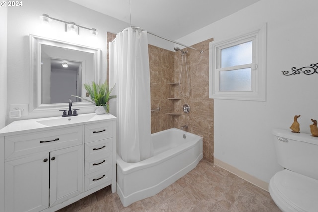 full bathroom with vanity, shower / bath combination with curtain, and toilet