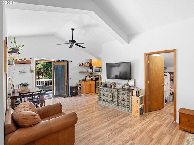 living room with lofted ceiling with beams, light hardwood / wood-style flooring, and ceiling fan