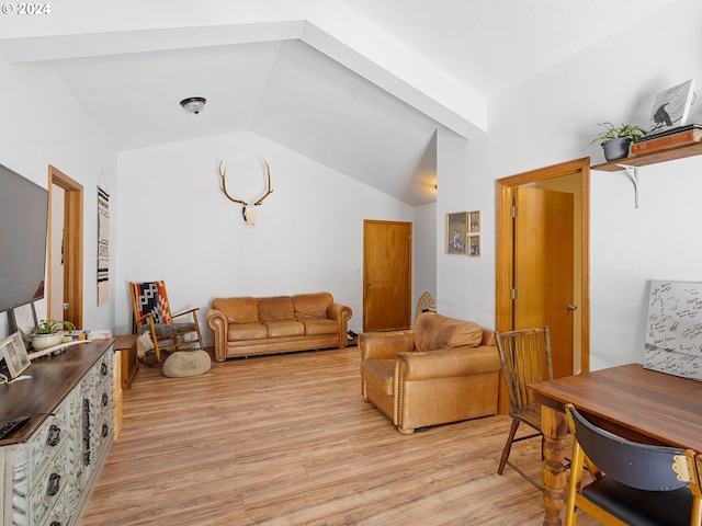 living room with lofted ceiling with beams and light hardwood / wood-style floors