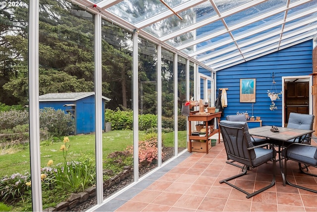 sunroom featuring lofted ceiling