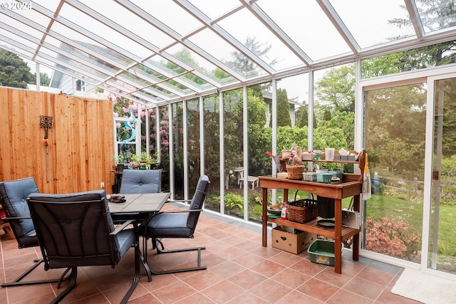 sunroom with vaulted ceiling and plenty of natural light