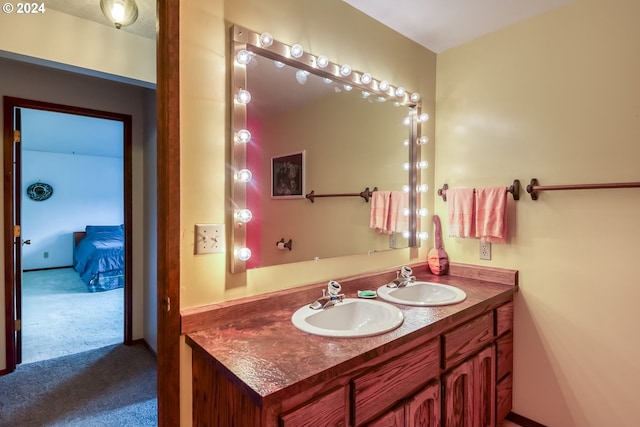 bathroom with vanity with extensive cabinet space and double sink