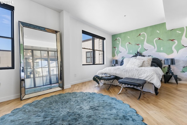 bedroom featuring access to outside and light wood-type flooring