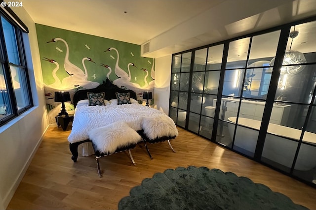 bedroom featuring wood-type flooring