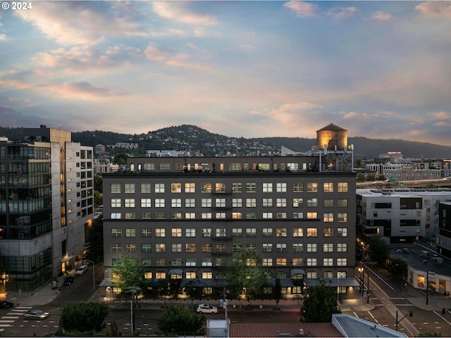 property's view of city with a mountain view