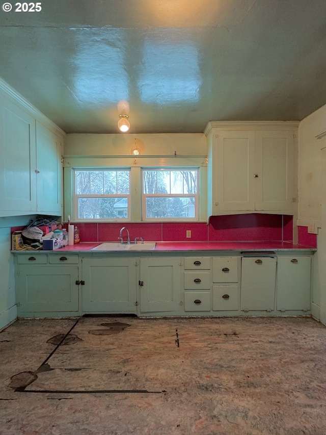 kitchen with white cabinetry, plenty of natural light, and sink