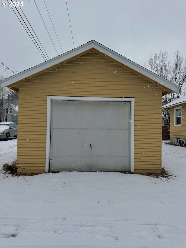 view of snow covered garage