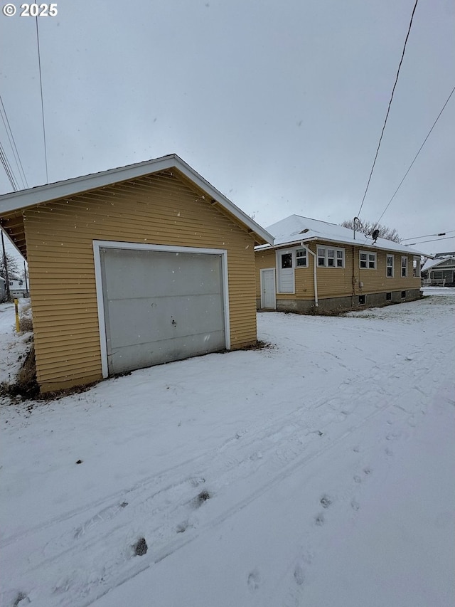 view of snow covered garage