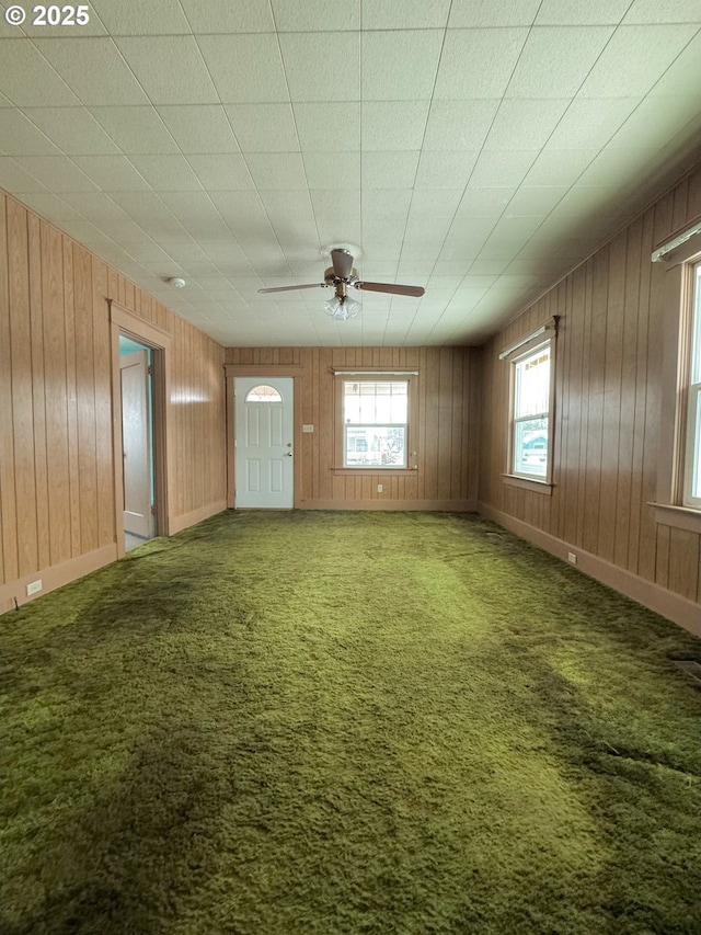 carpeted empty room with ceiling fan