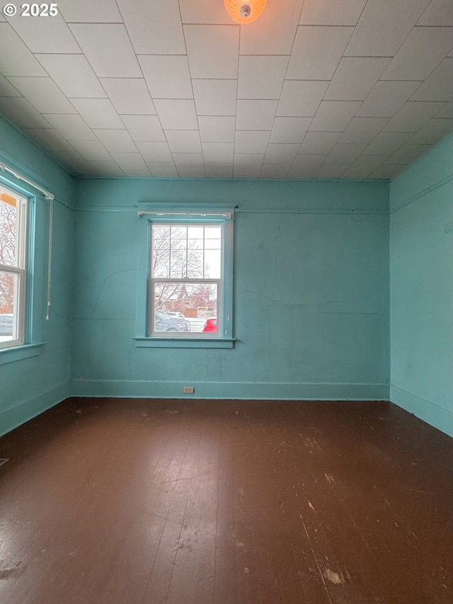 empty room featuring dark hardwood / wood-style flooring