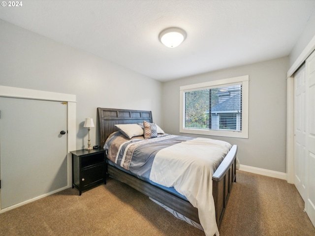 carpeted bedroom featuring a closet