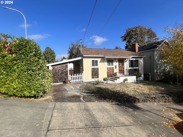 view of front facade with a carport