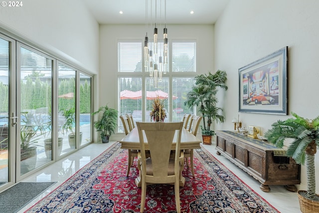 dining area featuring a high ceiling