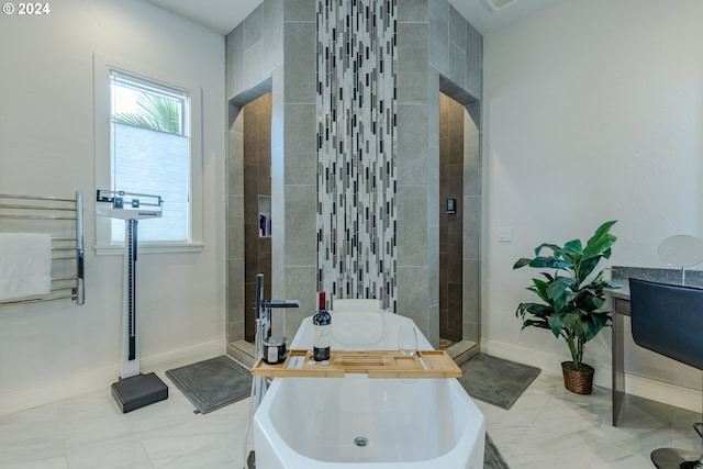 bathroom with shower with separate bathtub