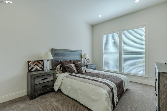 bedroom with light colored carpet