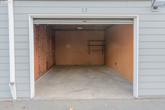 garage featuring wood walls