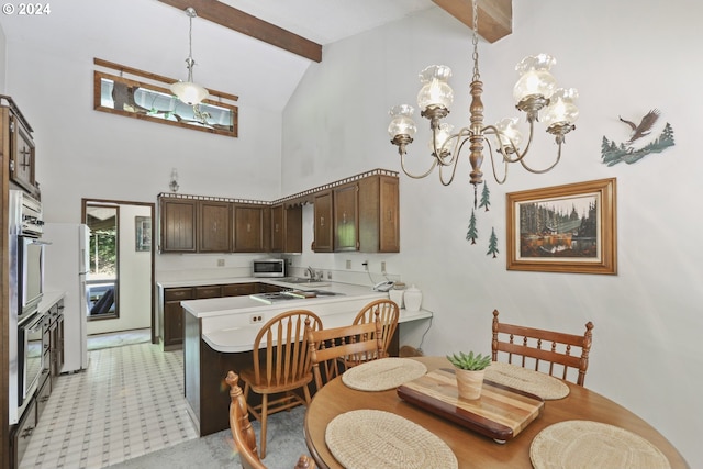 dining space with a notable chandelier, sink, beam ceiling, and high vaulted ceiling