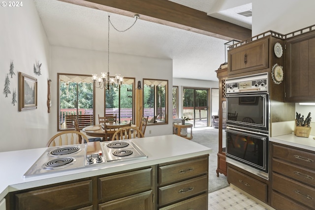 kitchen with white electric stovetop, beam ceiling, an inviting chandelier, black double oven, and decorative light fixtures