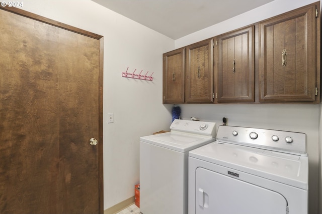 laundry area with cabinets and washer and dryer