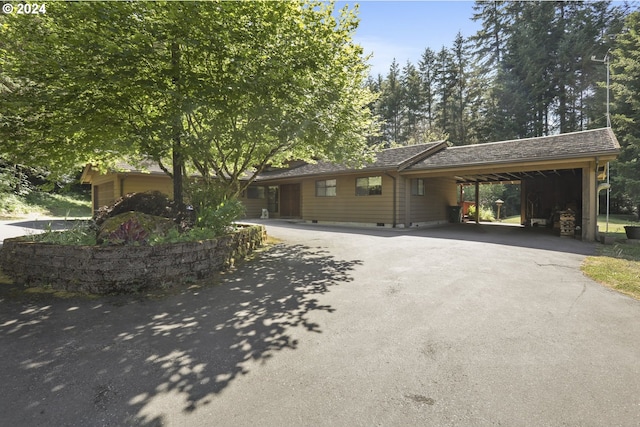 single story home with a carport