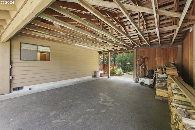 miscellaneous room featuring wood walls