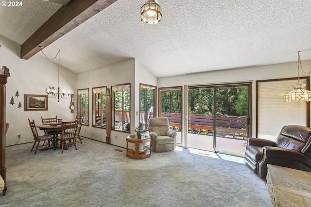 carpeted living room with a textured ceiling and vaulted ceiling with beams