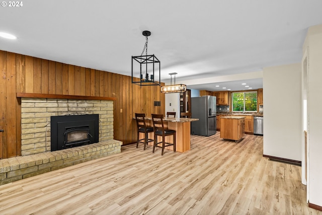 39145 Eagles Rest Rd, Dexter, OR 97431 - interior space with light wood-type flooring, wooden walls, a fireplace, and recessed lighting