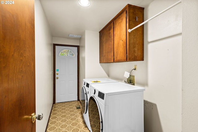 39145 Eagles Rest Rd, Dexter, OR 97431 - washroom with washing machine and clothes dryer, light floors, cabinet space, and visible vents